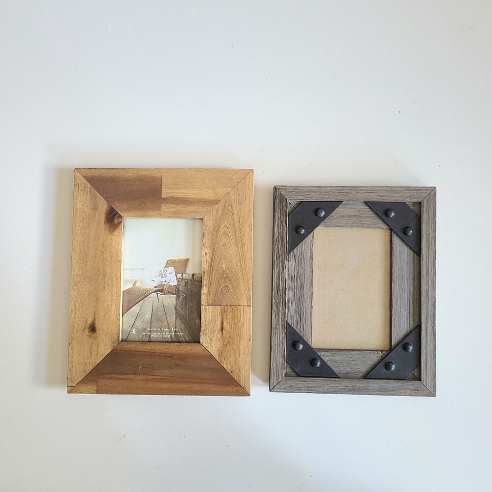 2 wooden frames with glass.
